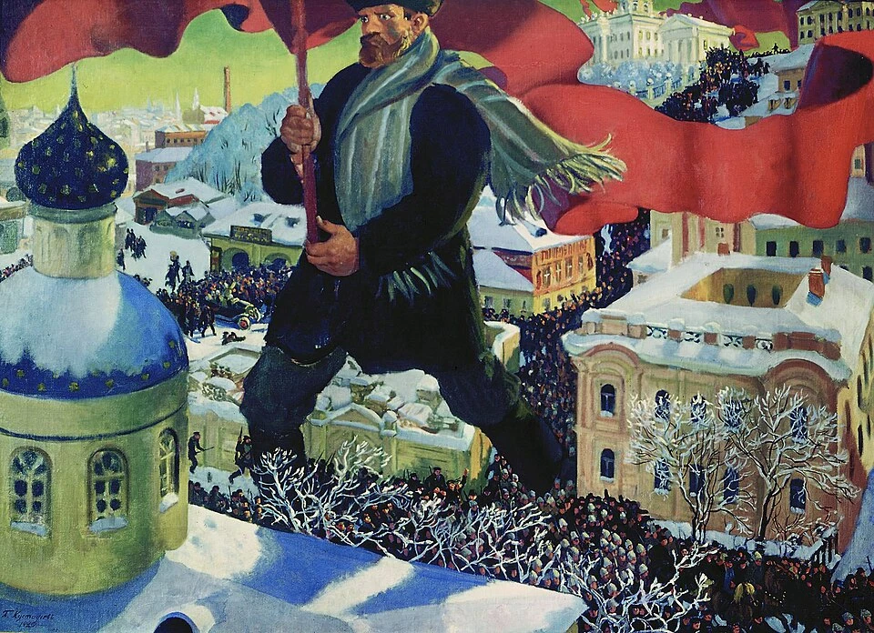 Гигантская фигура большевика возвышается над городом как символ революции.